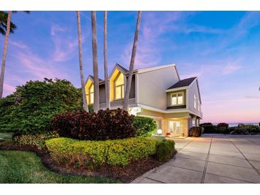 Stunning waterfront home with mature landscaping and a private driveway at 30 Tidy Island Blvd, Bradenton, FL 34210