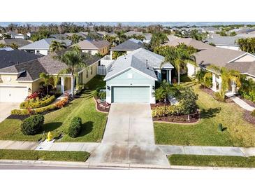 Aerial view of a single-Gathering home in a residential community with lush landscaping at 4121 Deep Creek Ter, Parrish, FL 34219