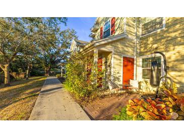 Townhome with red door, and walkway to street at 4850 51St W St # 9106, Bradenton, FL 34210