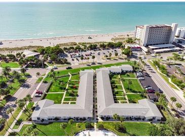 Aerial view of coastal property, showing building and ocean at 100 The Esplanade N # 6, Venice, FL 34285