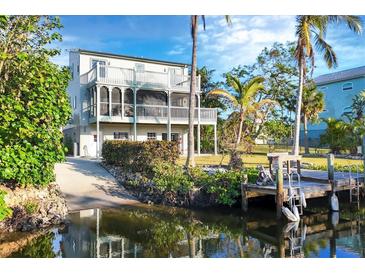 Two-story waterfront home with private dock and boat lift at 115 Burns Rd, Terra Ceia, FL 34250