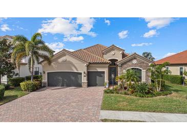 Beautiful one-story home with a two-car garage and well-manicured landscaping at 13013 Ramblewood Trl, Bradenton, FL 34211