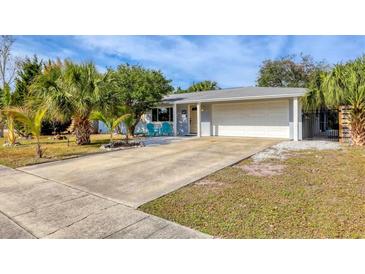 Bright, charming home with a large driveway and tropical landscaping at 2503 Bispham Rd, Sarasota, FL 34231