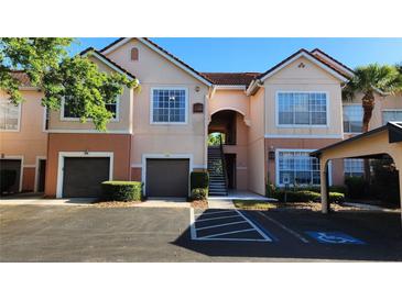 Two-story condo building with parking and landscaped grounds at 4122 Central Sarasota Pkwy # 1925, Sarasota, FL 34238