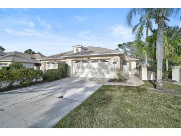 Attractive single-story home with two-car garage and landscaped yard at 4728 Sand Trap Street E Cir, Bradenton, FL 34203