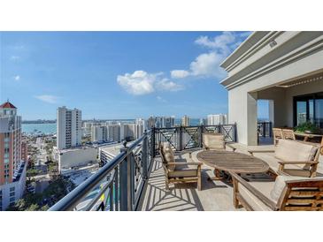 Spacious balcony with city and water views, perfect for outdoor entertaining at 50 Central Ave # 17Phc, Sarasota, FL 34236