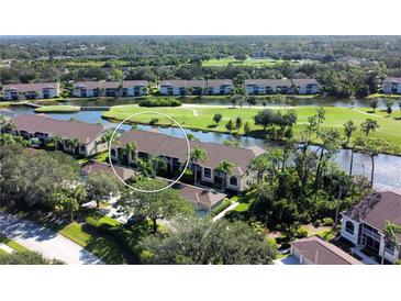 Aerial view of condo community near golf course and water at 5360 Hyland Hills Ave # 2622, Sarasota, FL 34241