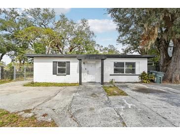 Charming single story home with a well-maintained front yard and driveway at 609 10Th E Ave, Bradenton, FL 34208