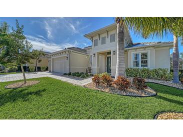 Attractive single-story home with a nicely landscaped front yard at 7087 Tamworth Pkwy, Sarasota, FL 34241