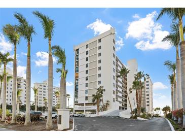 Stunning beachfront building with palm trees and ample parking at 11 Sunset Dr # 406, Sarasota, FL 34236