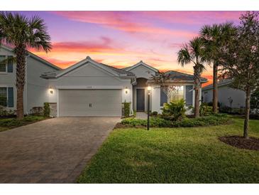 Beautiful one-story home with a two-car garage and a nicely landscaped lawn at 3314 Chestertown Loop, Bradenton, FL 34211