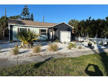 Cute bungalow with updated facade, landscaping, and a white picket fence at 5317 19Th S Ave, Gulfport, FL 33707