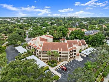 Aerial view of a condo complex showcasing its building and landscaping at 800 Hudson Ave # 105, Sarasota, FL 34236