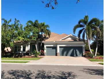 Beautiful home with three-car garage and lush landscaping at 7709 River Preserve Dr, Bradenton, FL 34212