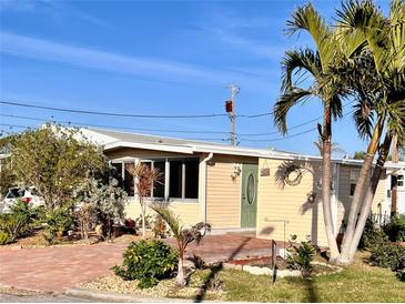 Cute bungalow with a landscaped yard and welcoming front porch at 108 1St Ave, Venice, FL 34285