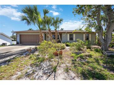 Ranch style home with mature landscaping and attached garage at 1119 76Th Nw St, Bradenton, FL 34209