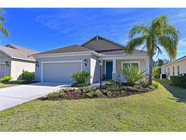 Attractive single-story house with a two-car garage and landscaped front yard at 11924 Forest Park Cir, Bradenton, FL 34211