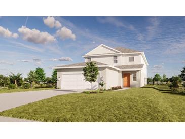 Two-story house with white siding, two-car garage, and landscaping at 13119 Cedar Elm Lane, Parrish, FL 34219