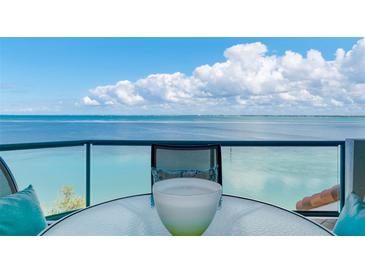 Enjoy breathtaking ocean views from this spacious balcony with comfortable seating, perfect for relaxing and entertaining at 380 Gulf Of Mexico Dr # 536, Longboat Key, FL 34228