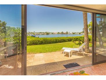 Relaxing patio with lounge chair and view of the water at 6200 Flotilla Dr # 241, Holmes Beach, FL 34217