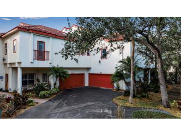 Two-story home with attached garage and lush landscaping at 6442 Mourning Dove Dr # 6442, Bradenton, FL 34210