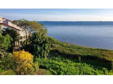 Beautiful waterfront view from a villa surrounded by lush greenery and plants at 6442 Mourning Dove Dr # 6442, Bradenton, FL 34210