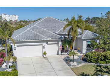 Beautiful single-Gathering home with tile roof, two-car garage, and lush landscaping at 1929 24Th Street W Cir, Palmetto, FL 34221