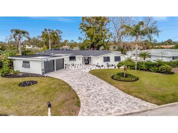 Stunning mid-century modern home with updated exterior and landscaping at 3219 Dawson St, Sarasota, FL 34239