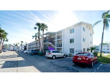 Two-story condo building with ample parking and lush landscaping at 2044 Canal Dr # M37, Bradenton, FL 34207