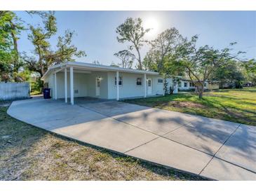 Newly renovated home with a carport and spacious driveway at 3107 34Th Avenue W Dr, Bradenton, FL 34205