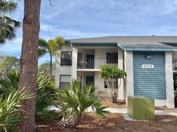Inviting condo building with attractive landscaping and a tranquil setting at 4515 45Th W Ave # 201A, Bradenton, FL 34210