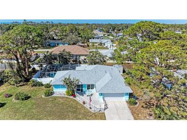 Inviting home with a screened pool, lush landscaping, and a serene neighborhood setting at 1346 Queen Rd, Venice, FL 34293