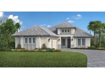 Two-story home with a light gray exterior, gray roof, and landscaping at 8516 Sandpoint St., Sarasota, FL 34240