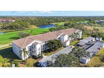 Beautiful condo building overlooking the golf course, lake, and landscape at 8755 Olde Hickory Ave # 7302, Sarasota, FL 34238