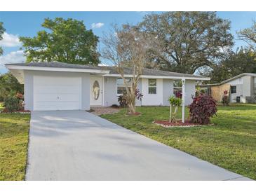 Charming single-story home with a well-manicured lawn and inviting curb appeal at 2079 Pellam Blvd, Port Charlotte, FL 33948