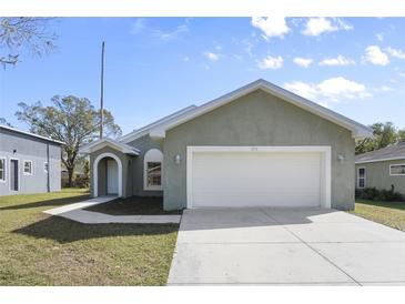 Newly constructed home with a two-car garage and a well-manicured lawn at 3711 20Th E St, Bradenton, FL 34208