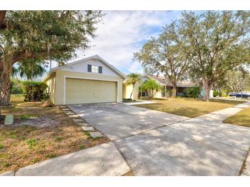 Quaint one-story home with long driveway and attached two-car garage at 406 116Th E St, Bradenton, FL 34212