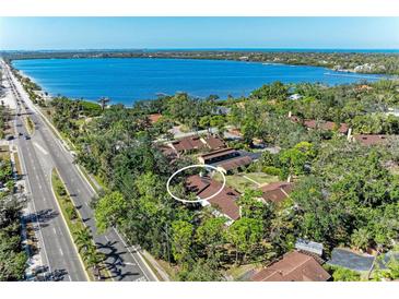 Beautiful aerial view of a condo community surrounded by lush greenery and a scenic waterfront at 7921 4Th W Ave, Bradenton, FL 34209