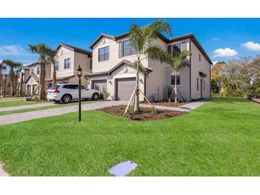 Beautiful new two-story home with attached garage and manicured lawn at 14906 Lyla Ter, Bradenton, FL 34211