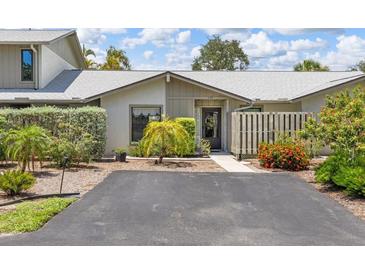 Charming single-story home featuring a well-maintained front yard and inviting entrance at 155 Jose Gaspar Dr # 155, Englewood, FL 34223