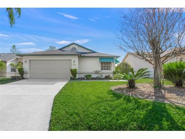 Charming single-story home with well-maintained lawn, attached garage, and a cozy, inviting curb appeal at 4410 Murfield E Dr, Bradenton, FL 34203