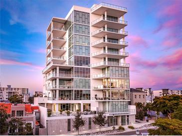 Stunning high-rise condo building boasts sleek modern design, walls of glass and multiple balconies at 1335 2Nd St # 402, Sarasota, FL 34236