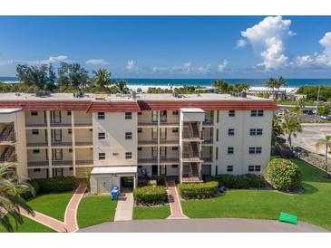 Low-rise beachfront condo building with well-maintained landscaping and access to the ocean at 901 Beach Rd # 402, Sarasota, FL 34242