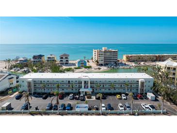 Waterfront condo building with tropical landscaping and parking, close to the beach, and with beautiful ocean views at 9200 Midnight Pass Rd # 20, Sarasota, FL 34242