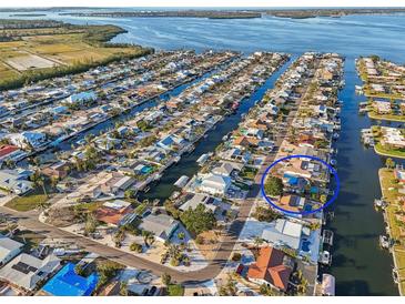 Waterfront property featuring a private pool, boat dock, and stunning views of the canal at 4119 Royal Palm Dr, Bradenton, FL 34210