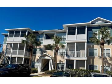 Attractive condo building featuring multiple stories, screened in balconies, and tasteful landscaping at 4802 51St W St # 1210, Bradenton, FL 34210