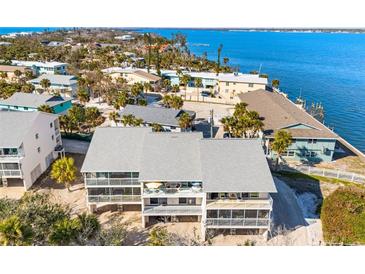 Waterfront home boasts multiple levels of outdoor balconies perfect for enjoying Gulf breezes and the beautiful scenery at 5031 N Beach Rd # 222, Englewood, FL 34223