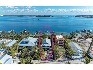 Stunning waterfront home with private dock access to the serene bay waters at 2308 Canasta Dr, Bradenton Beach, FL 34217