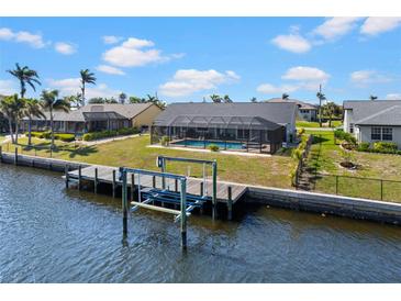 Waterfront home with a private pool and dock, offering direct access to the canal at 4196 Eastlake Ct, Port Charlotte, FL 33948