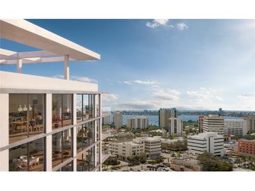 Stunning high-rise building with modern architecture and expansive views of the city skyline and bay at 1703 Main St # Ph 3, Sarasota, FL 34236